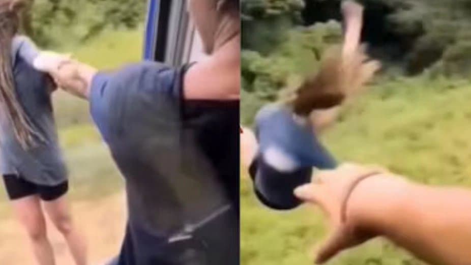 Shocking Video Of Woman Hanging Out Of Moving Train