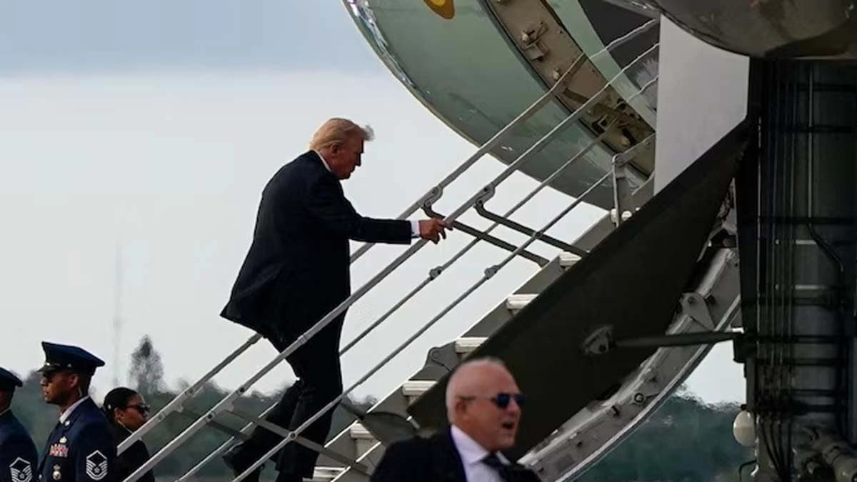 Trump boards Air Force One using small stairs after sniper nest found near Palm Beach International airport