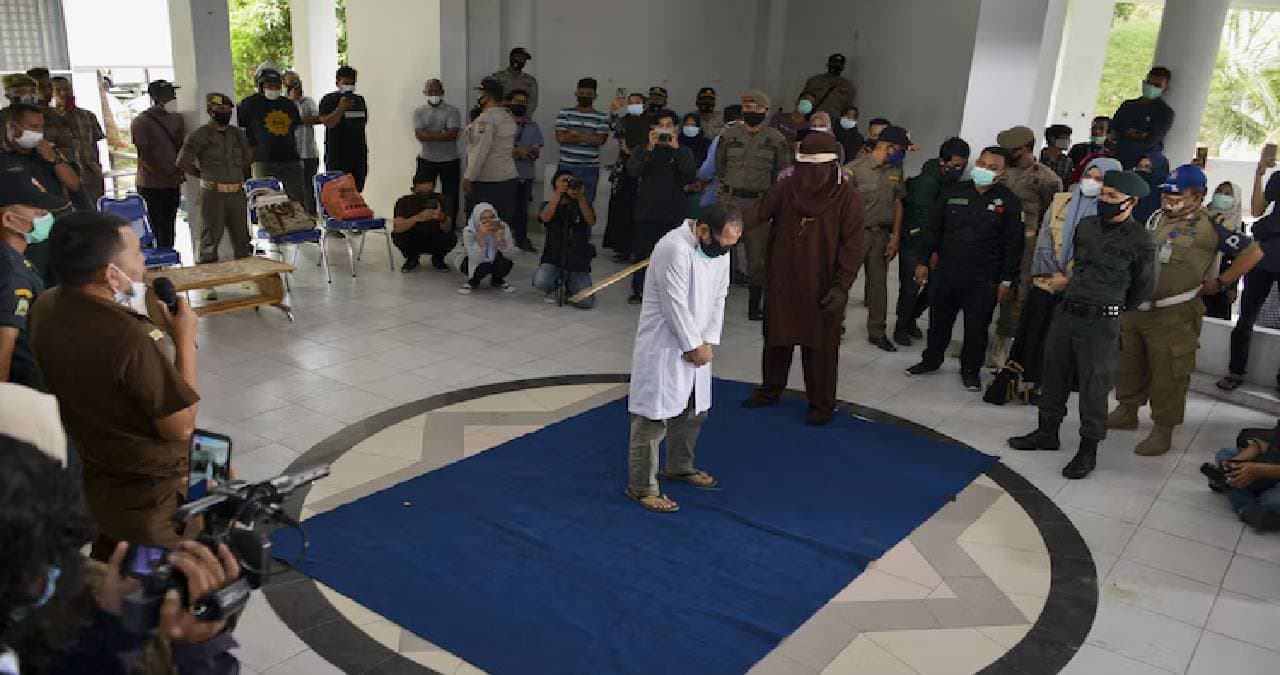 two men publicly flogged in Indonesia 
