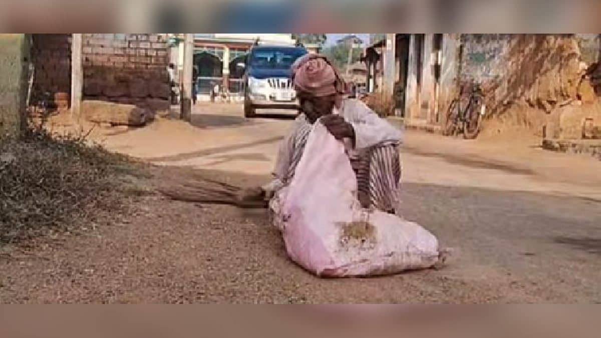 The elderly person kindling light of hope with broom