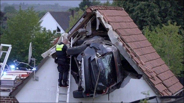 Car Goes Flying Into Barn Roof In Germany