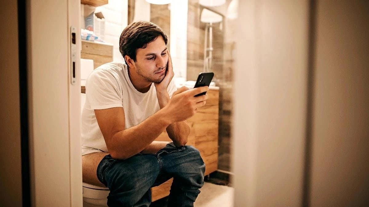 Using mobile while sitting on the Commode can be dangerous for health