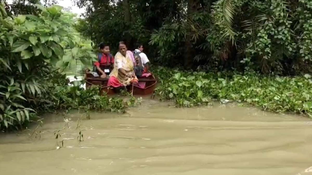 Teachers astonished when saw students are coming to school by boat in Ghatal