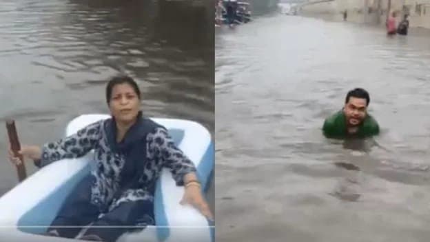Delhi Waterlogged After Heavy Rainfall Locals Swim Boat On Roads 