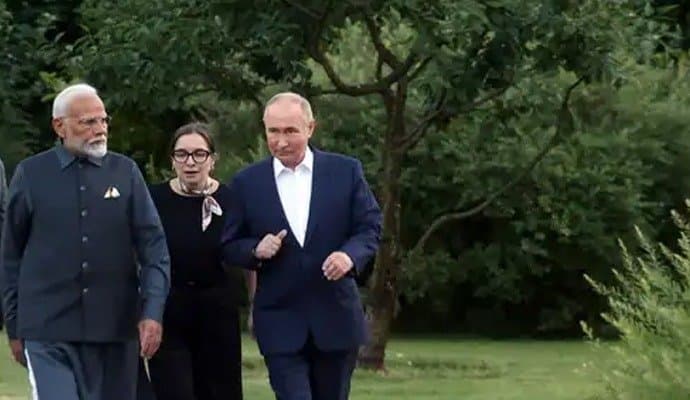 woman in black dress, present during pm modi-putin moscow meeting