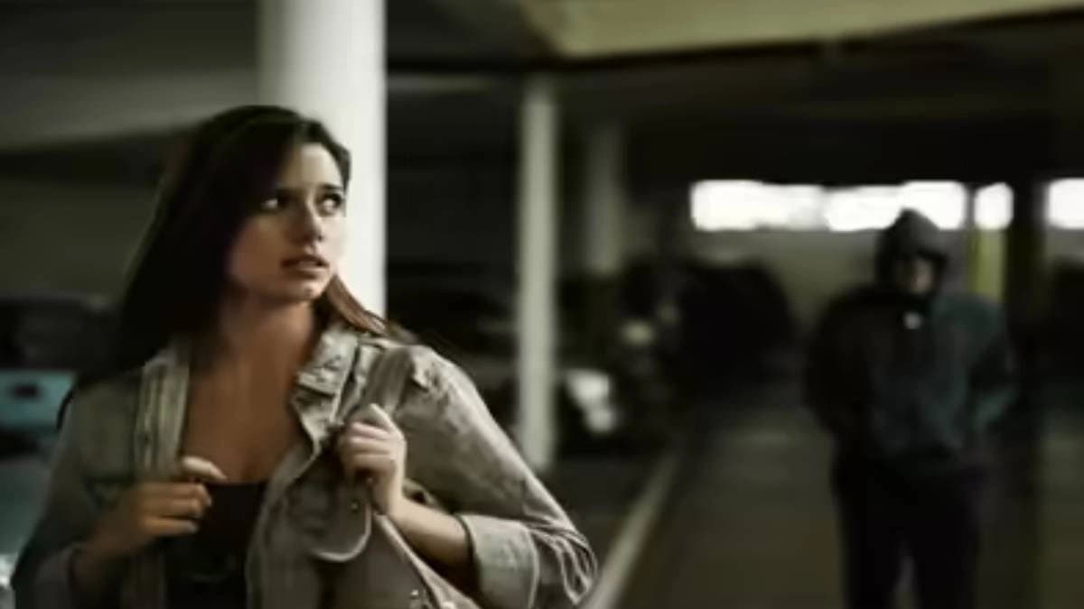 Man intimidating college student on campus