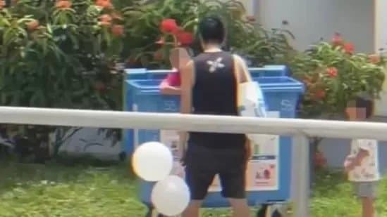 Father Putting Crying Baby in Recycling Bin As Siblings Watches in Singapore