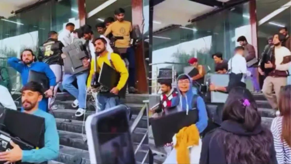 Mob looted monitor keyboard during raid in fake call centre in Pakistan