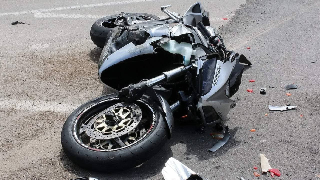Unable to control his anger the driver violently hit the bike 