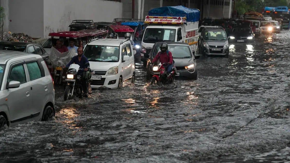 Heavy Rain In North India Flooding Traffic Chaos in Delhi Amid Red Alert