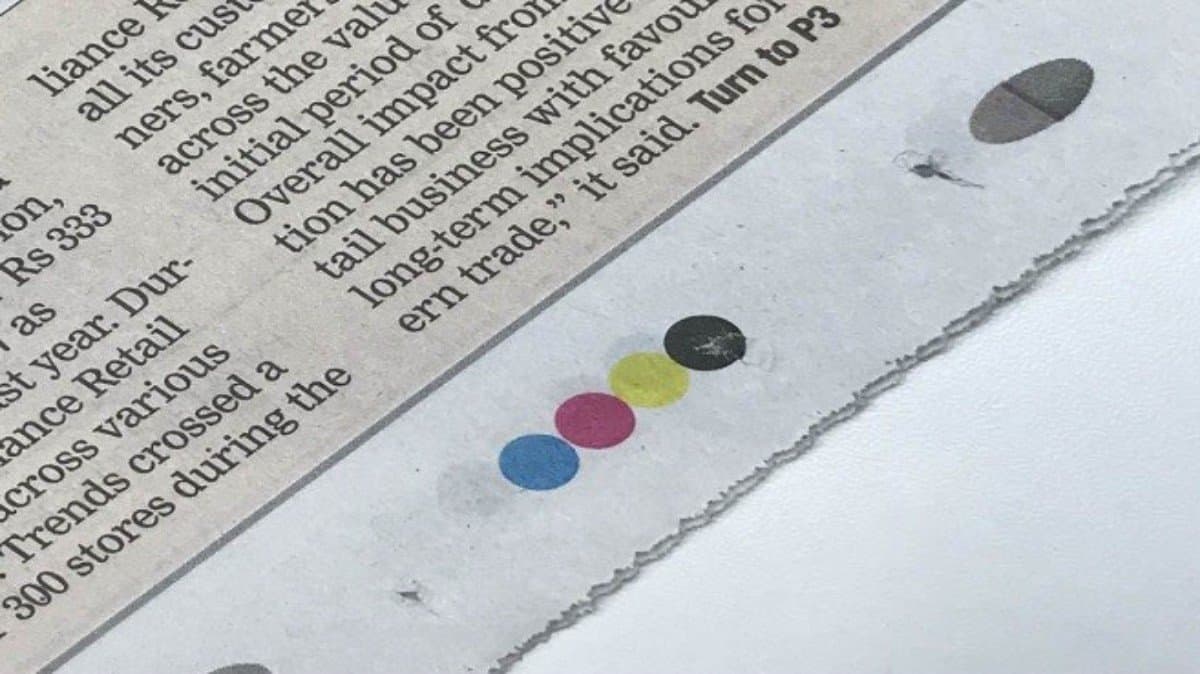 Why do newspapers have four coloured dots at the bottom of all pages gnr
