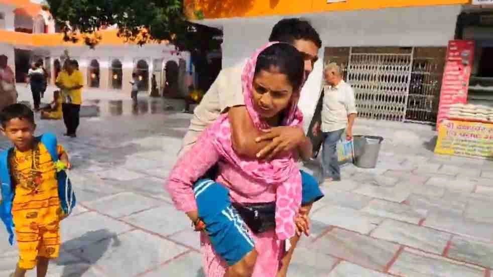 Woman Carries Paralysed Husband On 150 Km Kanwar Yatra