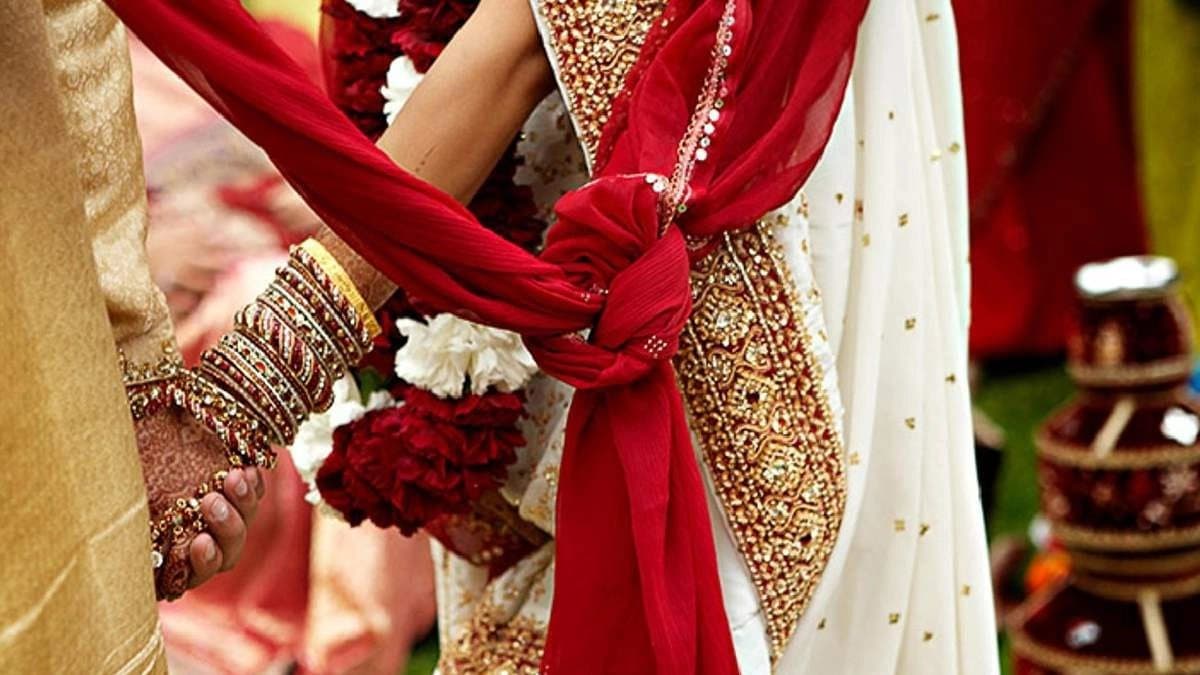 Madhya Pradesh man ties up wife puts hot knife in her mouth over dowry demands